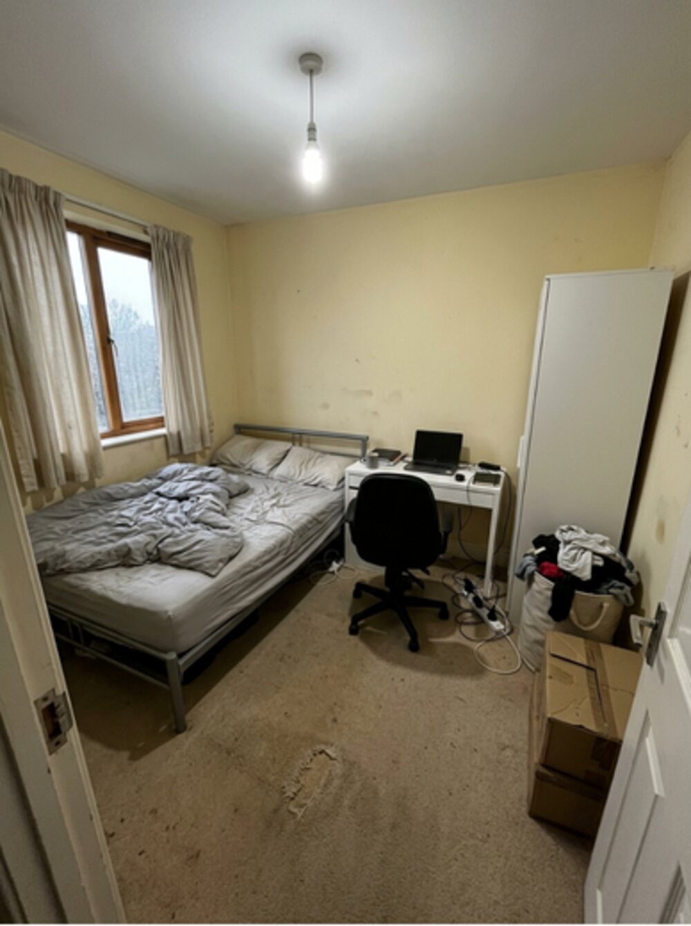 Yellow bedroom with bare mattress — neglected before