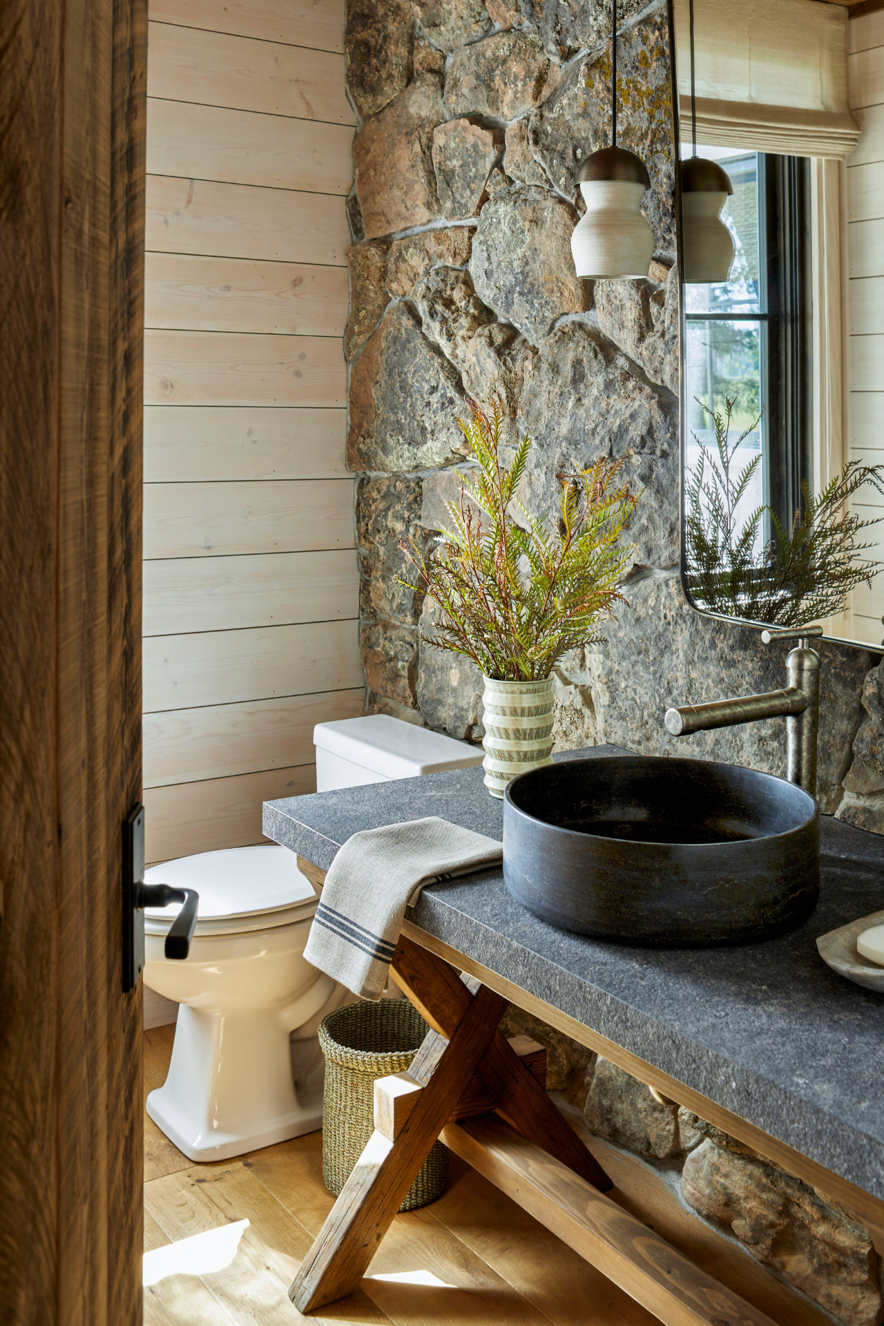 Neo-Industrial interior — stone and steel washroom